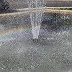 fontaine place neuve arc en ciel